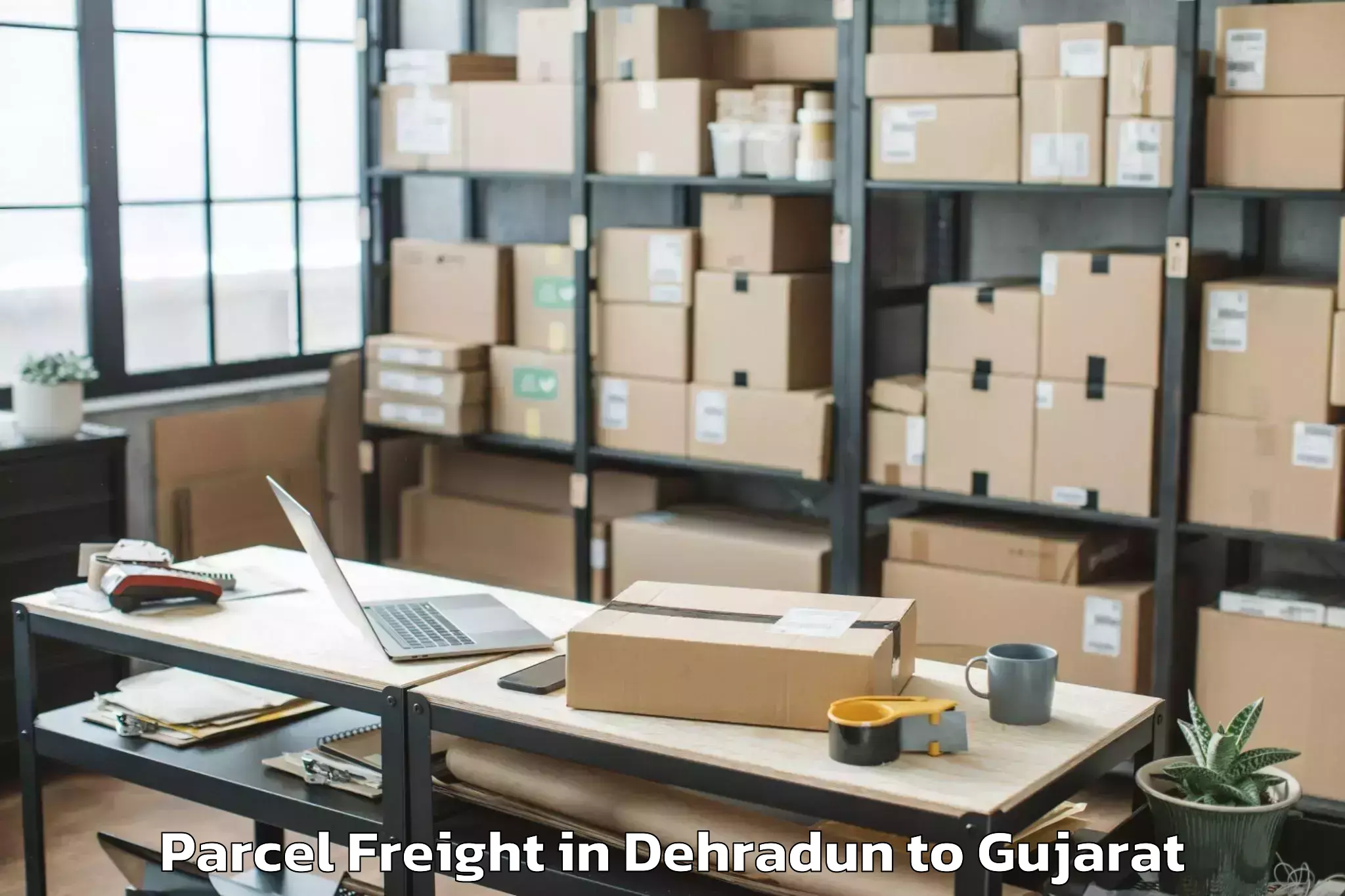 Book Your Dehradun to Navrangpura Parcel Freight Today